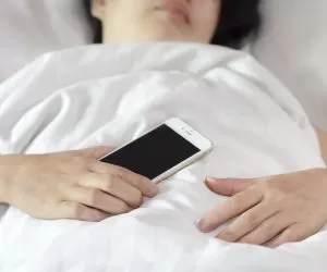 I Accidentally Slept on My Phone. What Are the (Health) Risks?